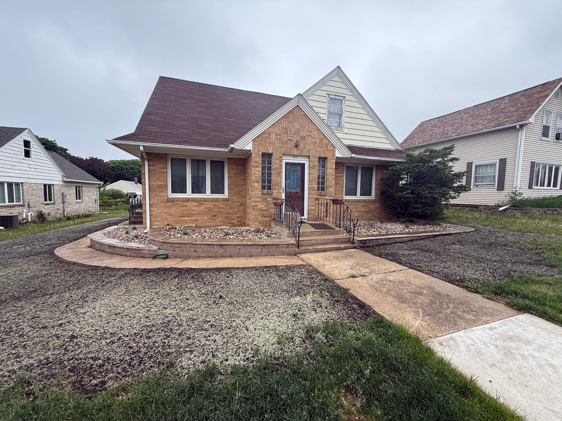 Raised Rock Beds Give This Front Entrance Real Structure image