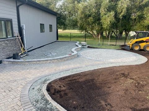 Expertly Crafted Paver Walkway and Patio Transformation
